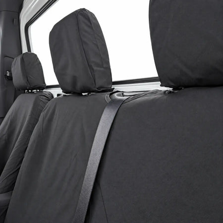 Close-up of black bench seat covers with headrest covers and seat belt access