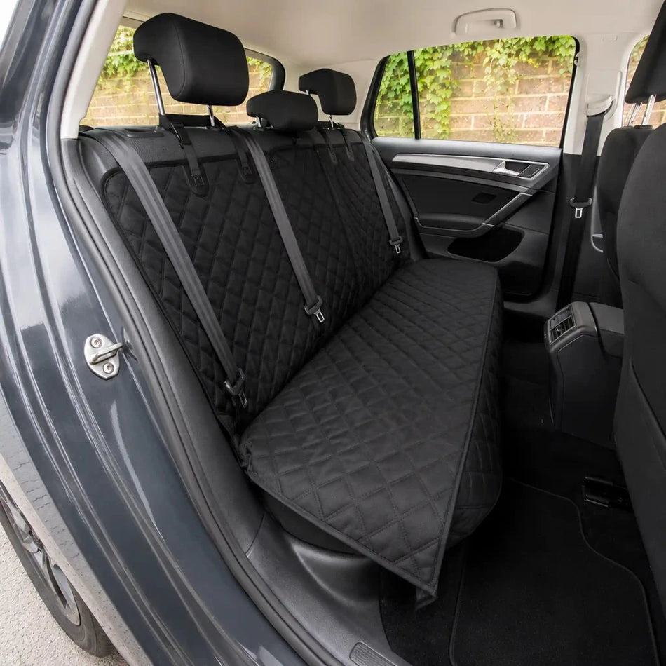 Black quilted car rear seat protector with fitted cover and safety straps