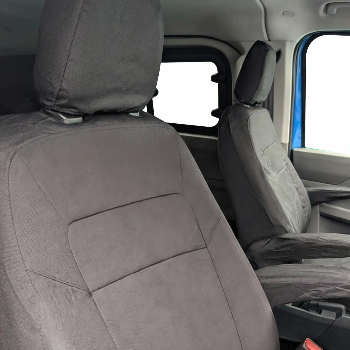 Black  car seat covers on a Volkswagen Transporter Kombi front seats with a clear view of the interior.