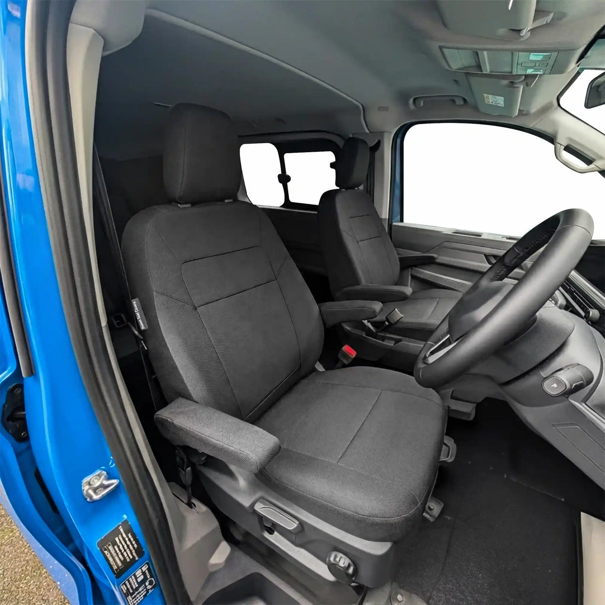 Black Seat covers fitted to a Ford Tourneo Custom front seats.