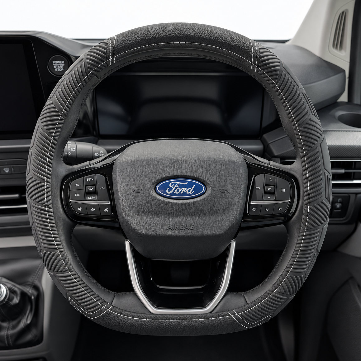 Black textured steering wheel cover with stitched rim and steering controls, Ford emblem