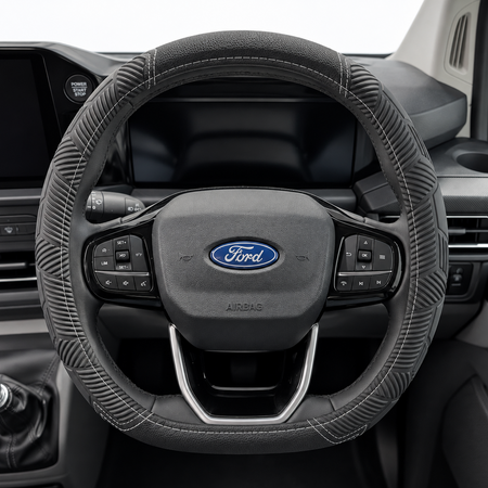 Black textured steering wheel cover with stitched rim and steering controls, Ford emblem