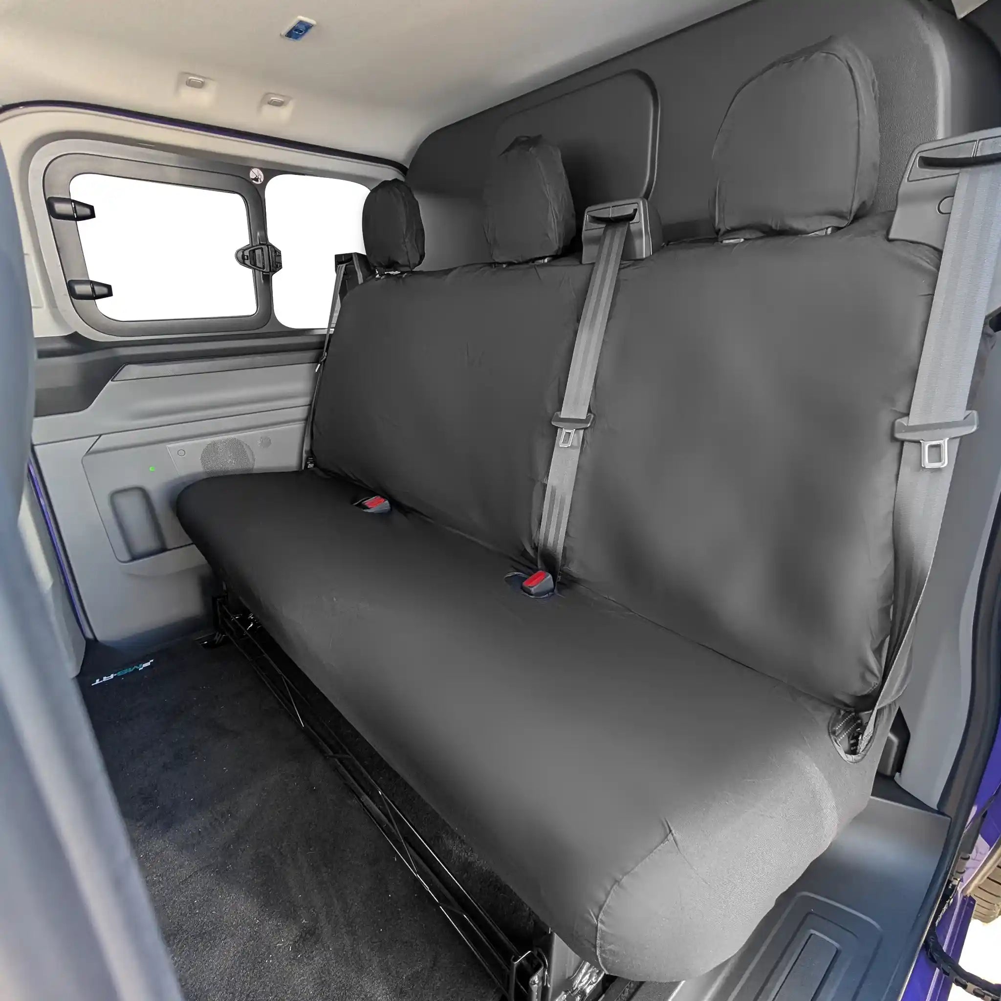 Black Ford Transit Custom rear bench seat cover in a vehicle interior