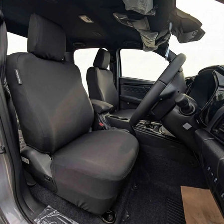 Front seat cover with padded headrest and seat cushion, dark fabric, side seams