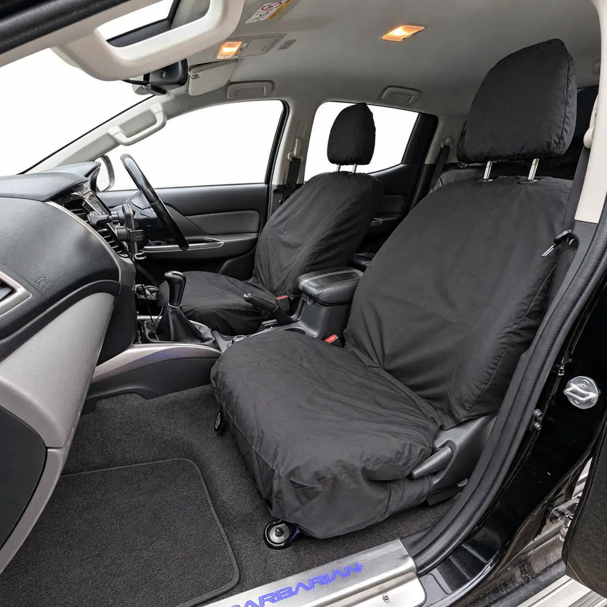 Black front seat covers for driver and single passenger, with headrest cutouts