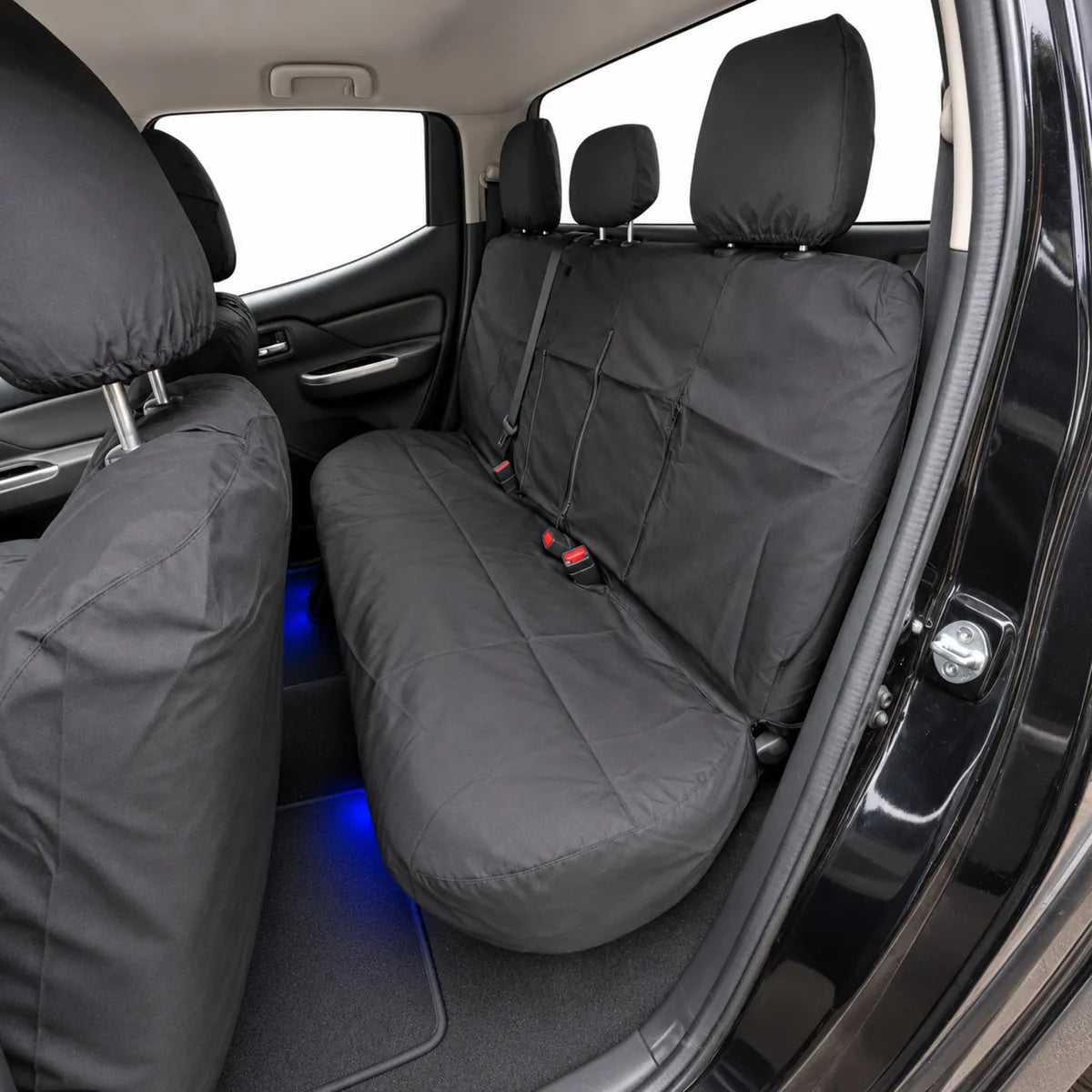 Black rear bench seat covers for pickup double cab, with headrest pads and armrest cutout