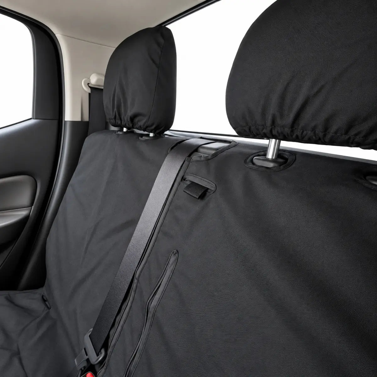 Black rear bench seat cover detail: center armrest cupholder and side panel openings