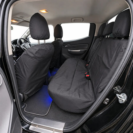 Black rear seat cover set with three-seat bench fit and visible seatbelt buckle cutouts