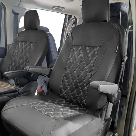 Black car seat covers with diamond pattern in a vehicle interior