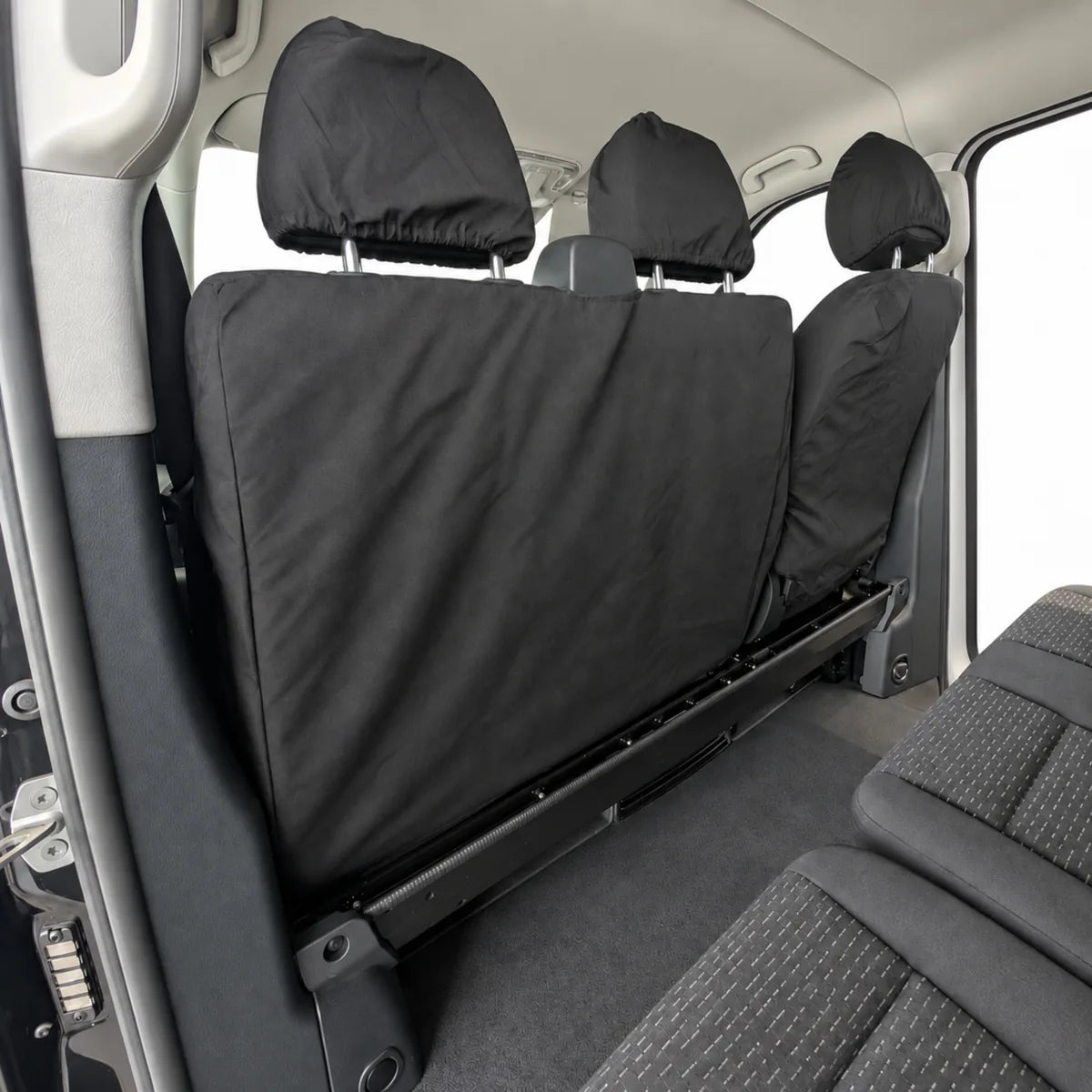 Mercedes Vito rear seat cover, black fitted cover with three headrest pads.