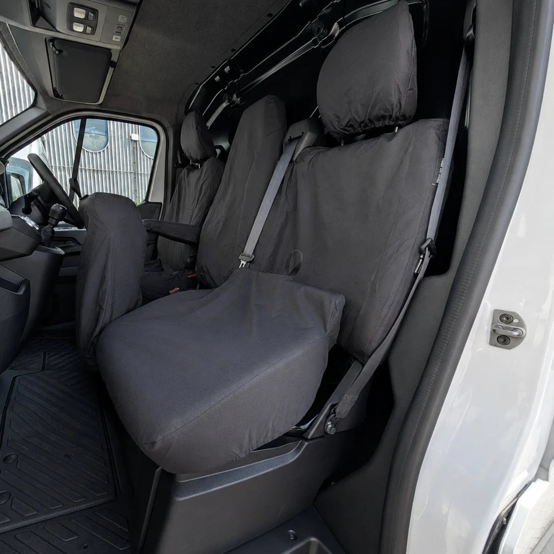 Black fitted seat covers for front passenger seats, with headrests and armrests.