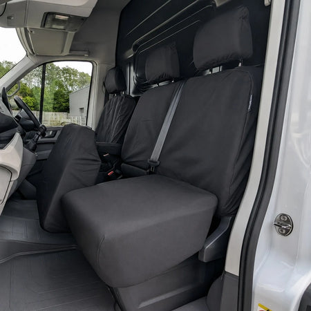 Dark driver seat cover for MAN TGE 2017+ with stitched panels and headrest
