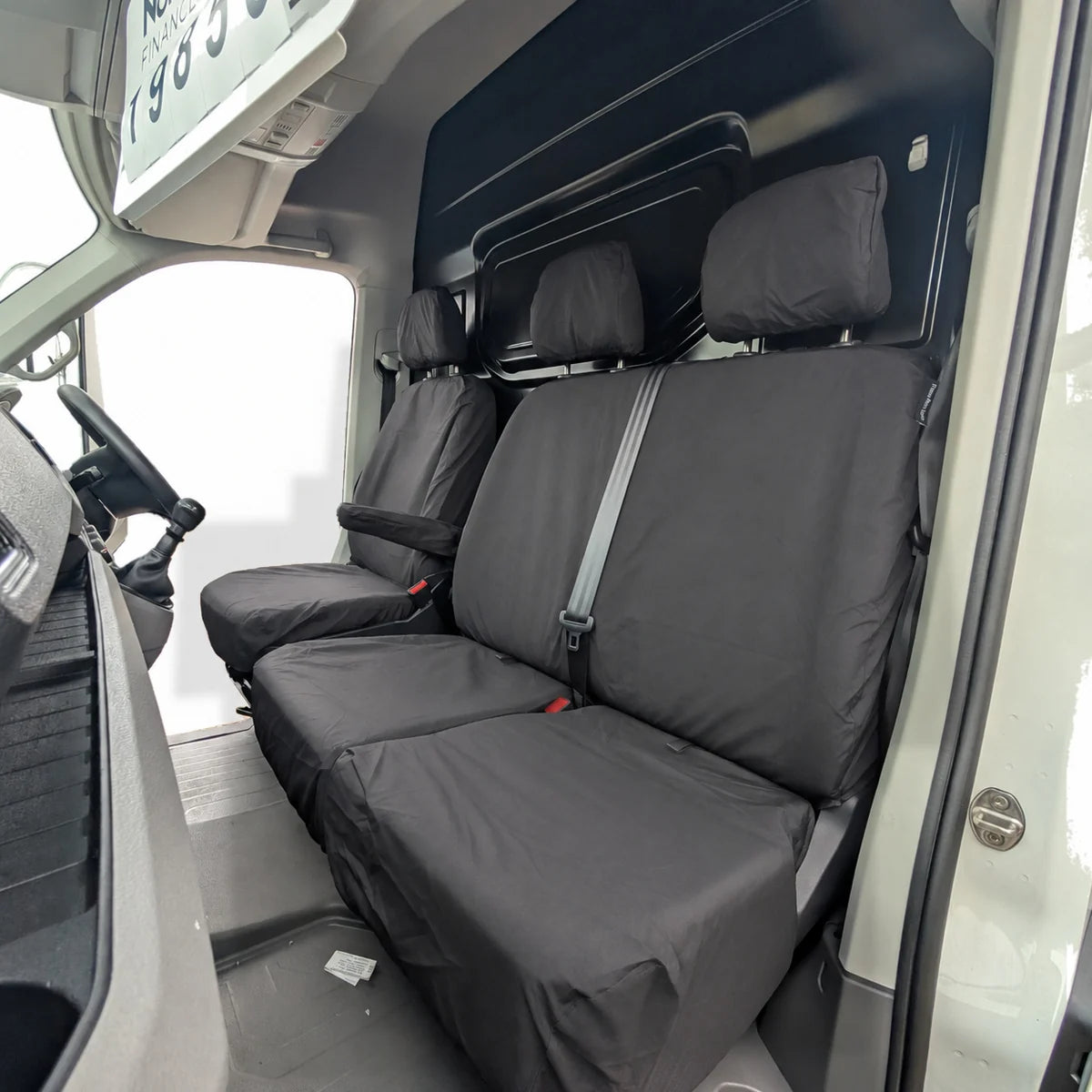 Black VW Crafter seat covers with light gray center stripe and headrests