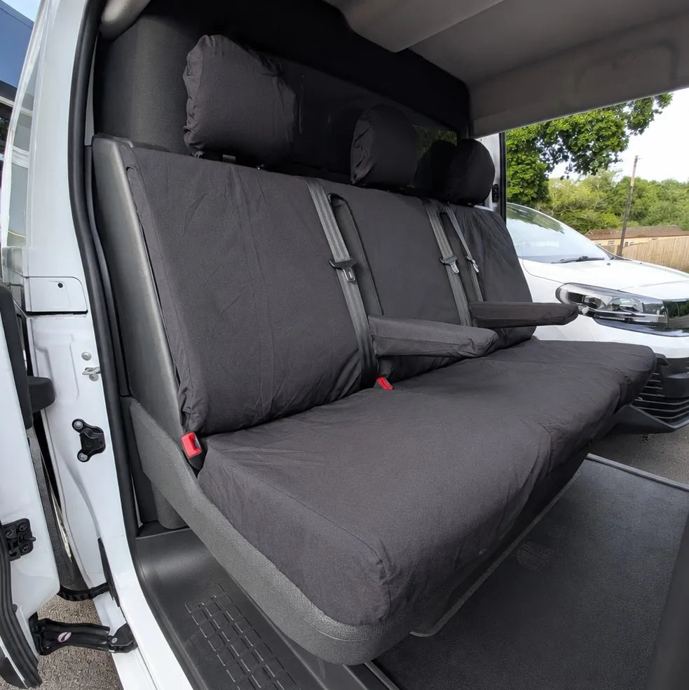Dark gray rear crew seat covers with split backrests and red buckle tabs