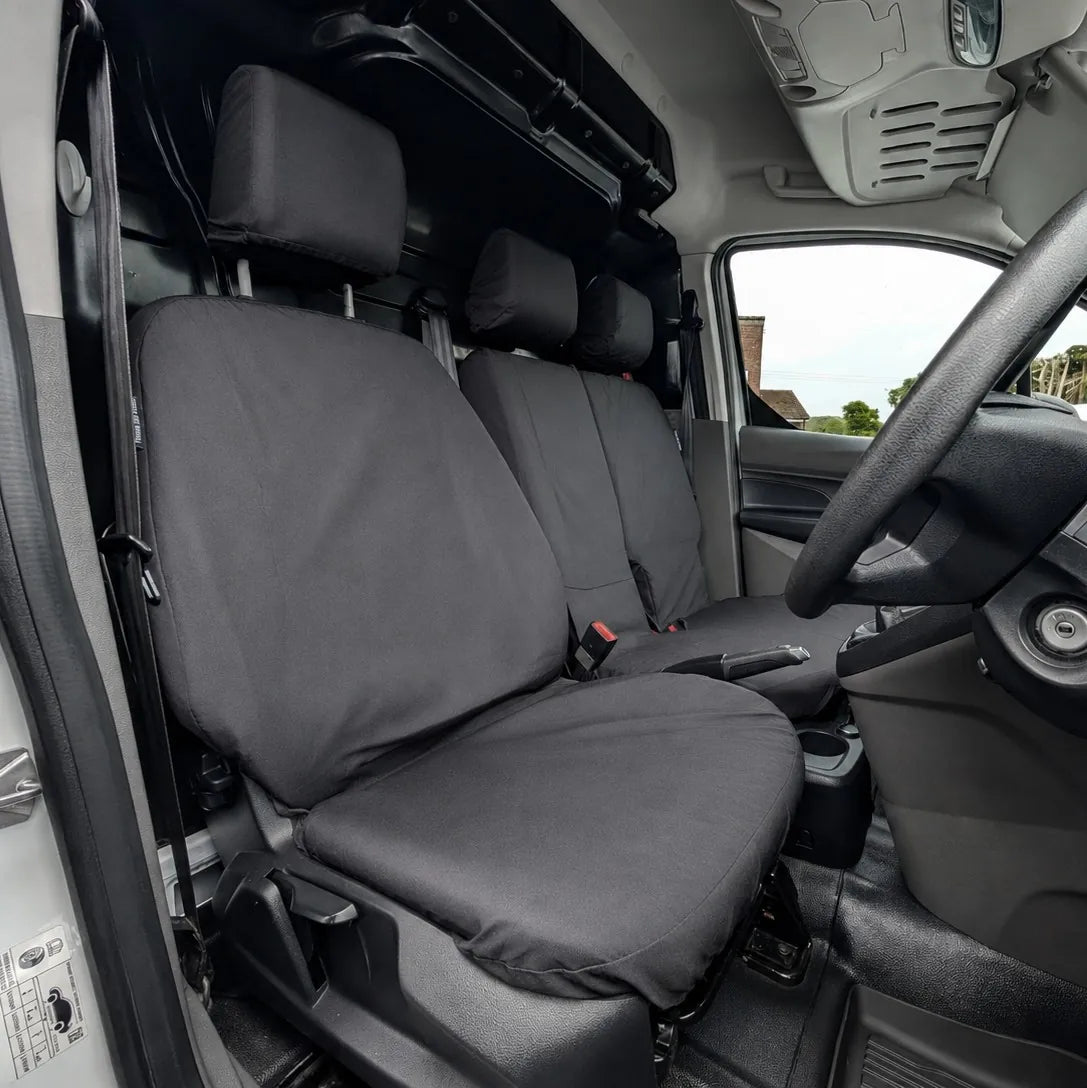 Front driver seat cover and passenger seat cover, dark gray fabric with red attachment points