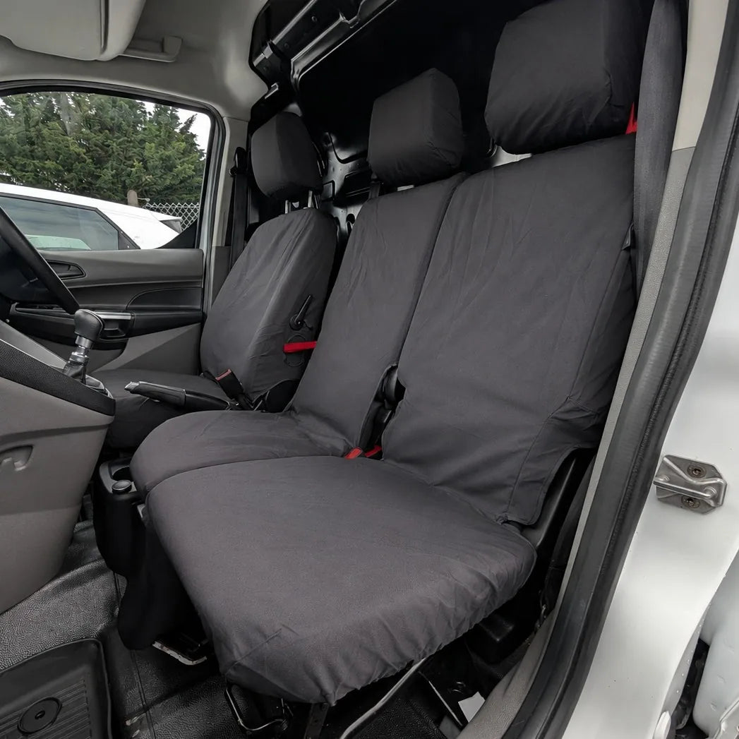 Front row seat covers, dark gray fitted cushions and headrests with red securing tabs