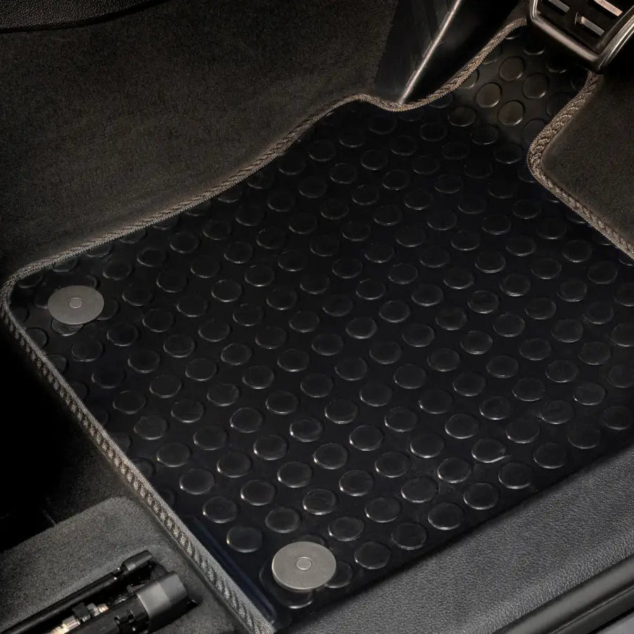 Rubber floor mats in the footwell of a car