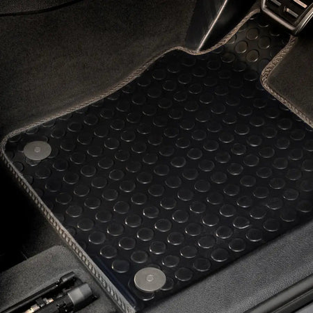 Rubber floor mats in the footwell of a car