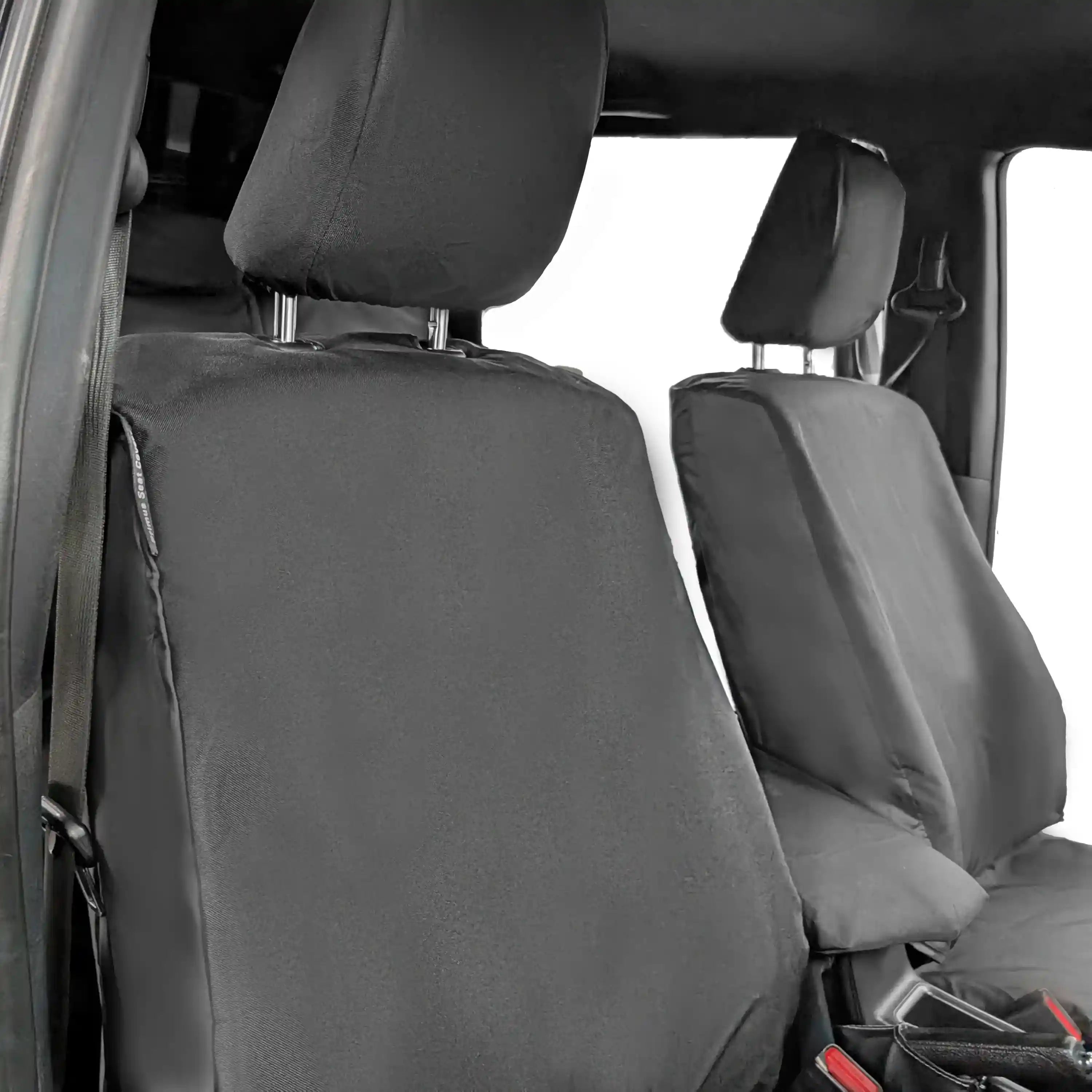 Black car seat covers on a vehicle's front seats with a white background