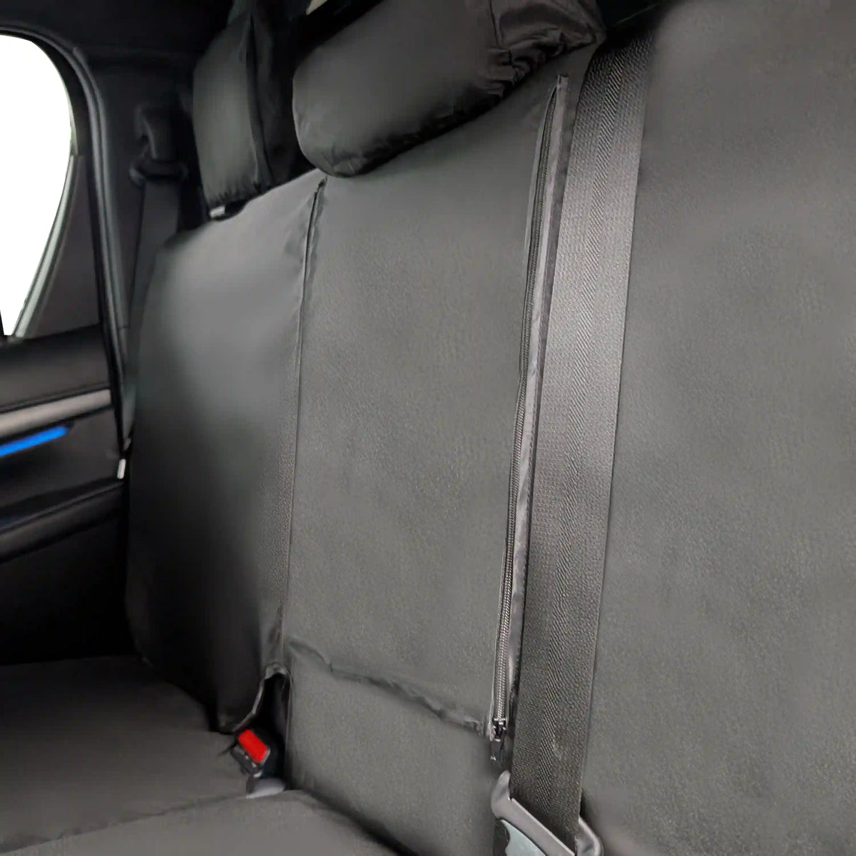 Close up showing the zip access to the fold sown tray on the Toyota Hilux rear seat covers
