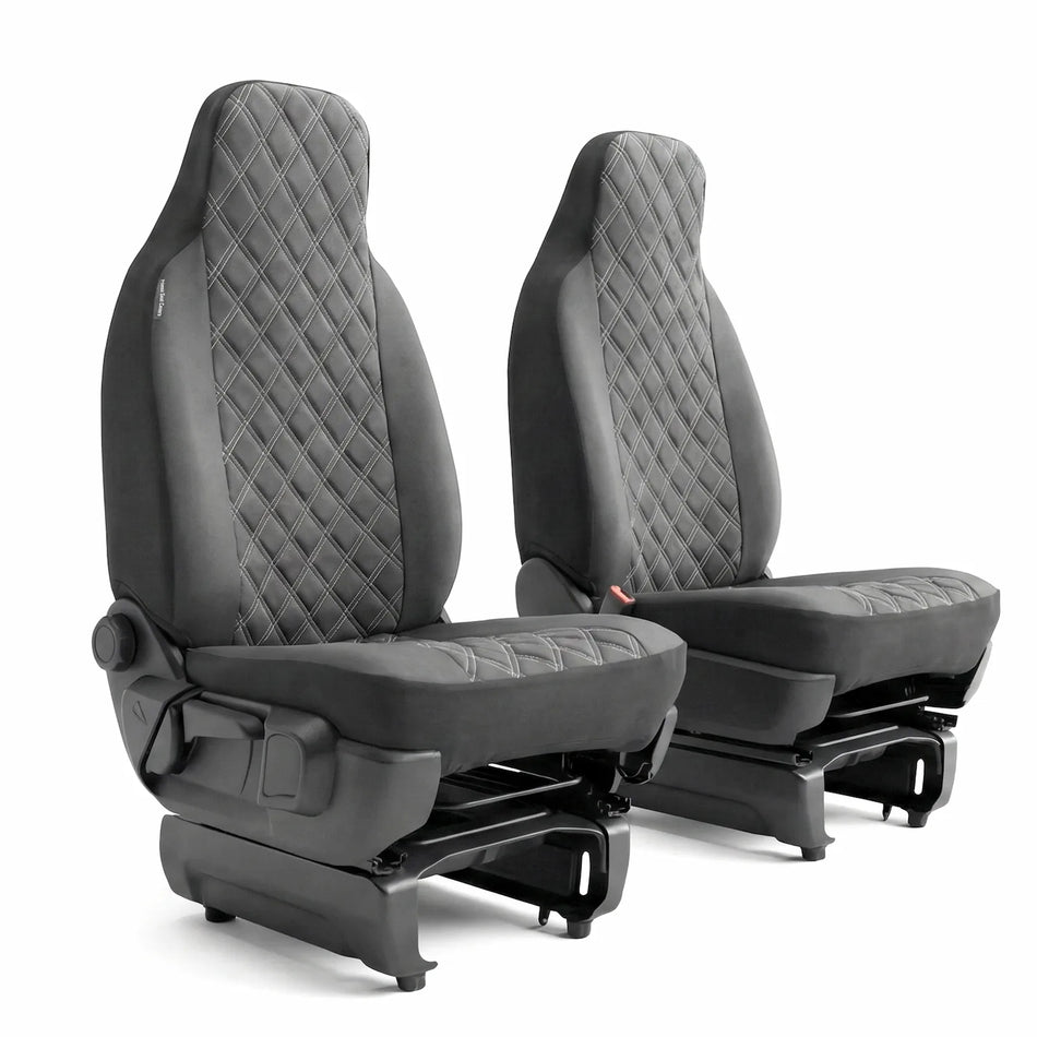 Pair of BLACK quilted car seats on a white background