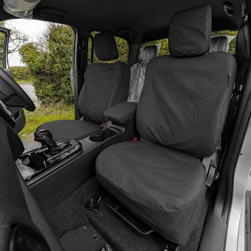 Car interior with black seat covers in a Isuzu D-Max Pickup Truck