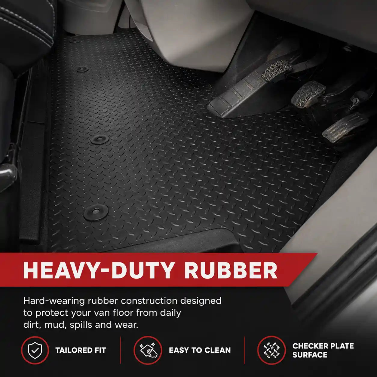 Black rubber van floor mat with diamond tread texture and molded nibs, under seats